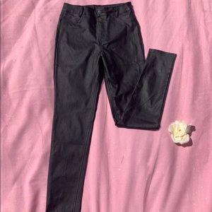 Jet-black leather jeans